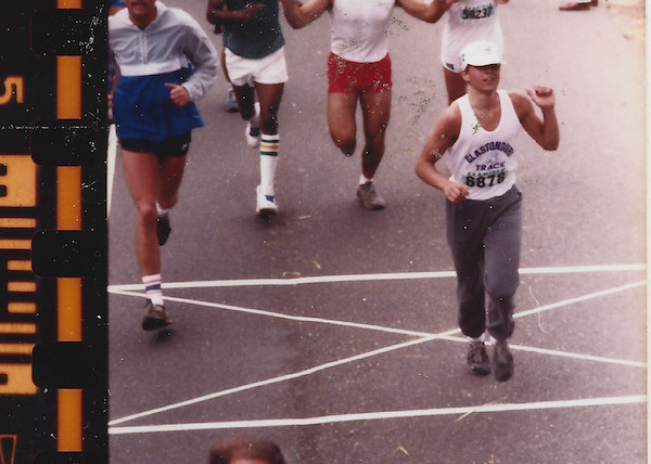 Peter at the finish of the Bay to Breakers, in sweats and a high school track team tank top.