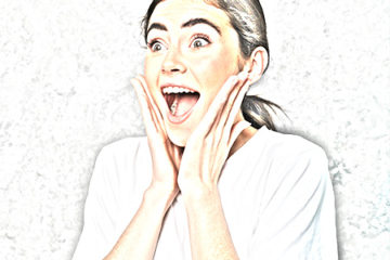 a super-excited woman smiling after getting testimonials and reviews