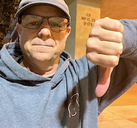 Peter is giving a thumbs-down like Debbie Downer, not celebrating milestones