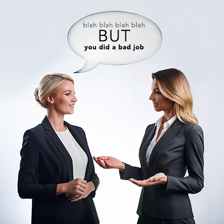 Two businesspeople talking; one says blah blah blah before the BUT and then tells the other she did a bad job.