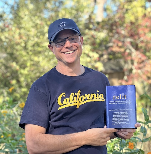 Peter in a Gray Bear hat and Cal shirt, holding the hardcover of RELIT. This was not from one of his most-viewed posts, but he looks happy anyway.